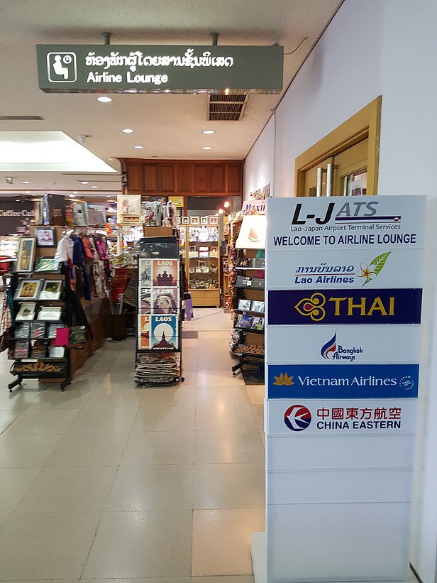 What important services does Wattay International offer? (Find out about lounges, shops, and food for your comfort)