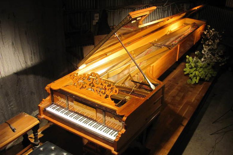 Who built the very first biggest piano? Uncover the amazing stories and people behind it.